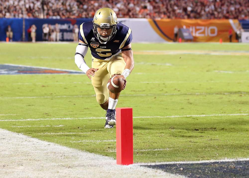 Tech quarterback Justin Thomas eyes the pylon as he dives for the end zone against Mississippi State in the Orange Bowl. (Marc Serota / Getty Images)