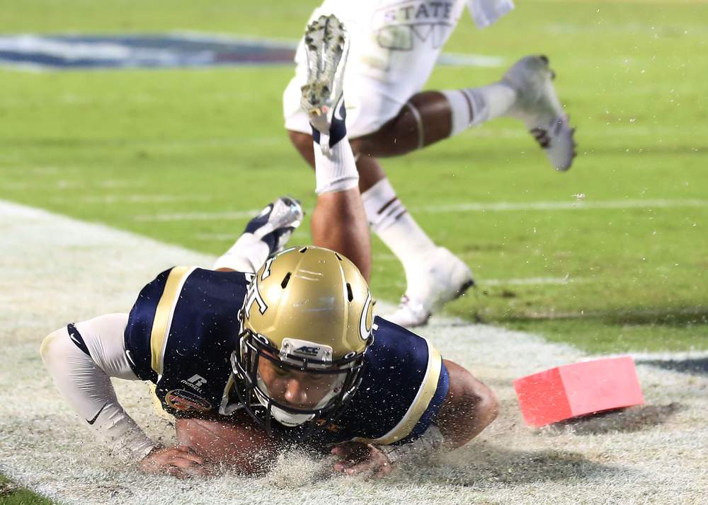 Tech quarterback Justin Thomas scores on the dive through the pylon against Mississippi State in the Orange Bowl. (Marc Serota / Getty Images)